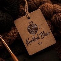 A kraft Knotted Bliss hang tag resting on brown yarn